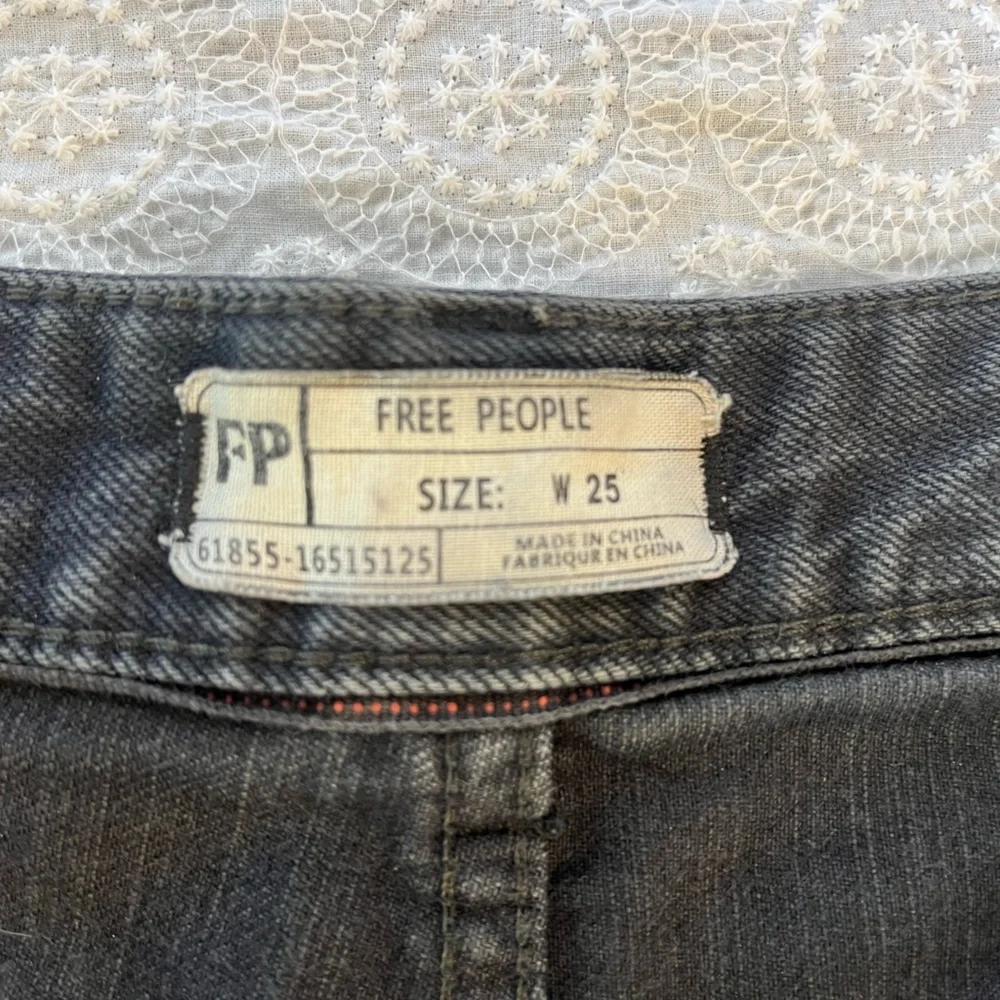 Free People black cut-off shorts, size 25; distressed black denim with raw hem